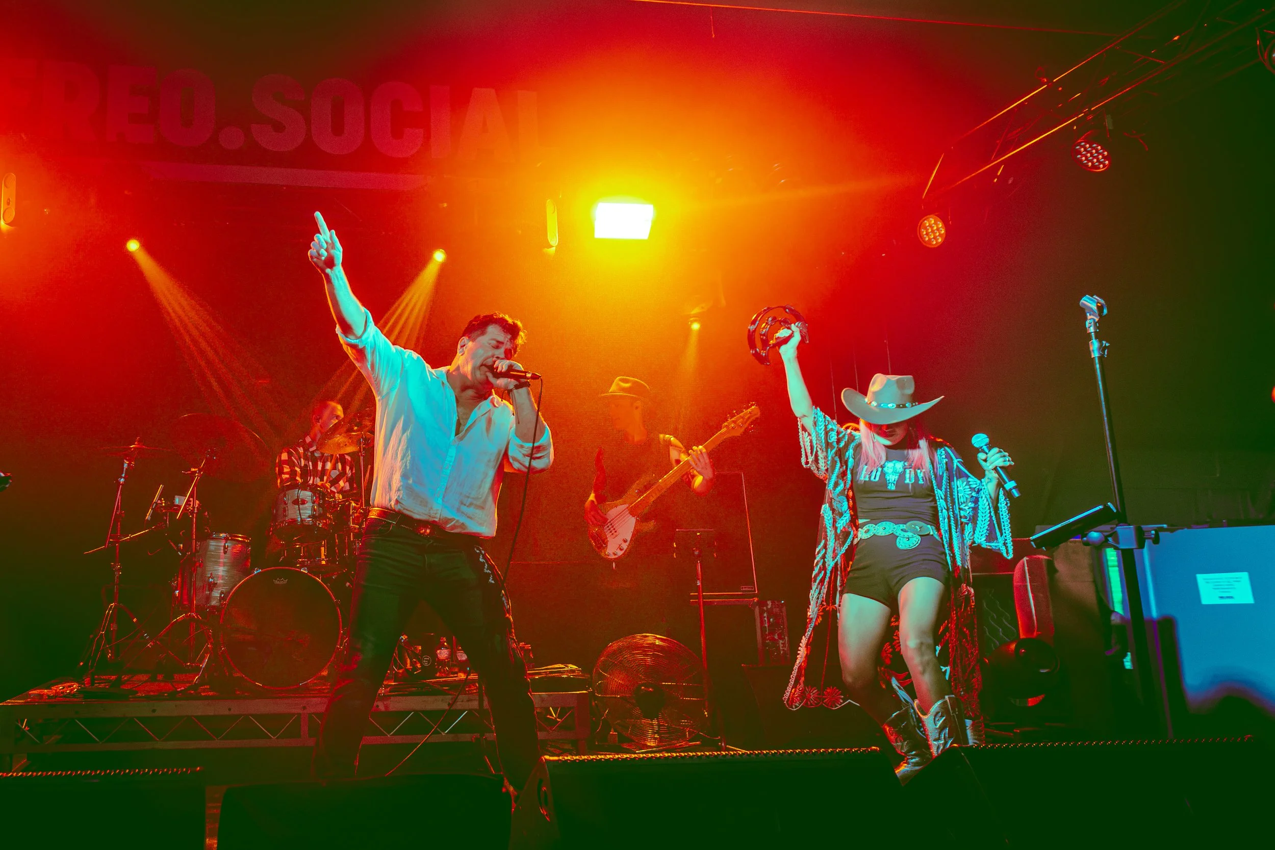 Boom Box Band on stage in front of a packed crowd