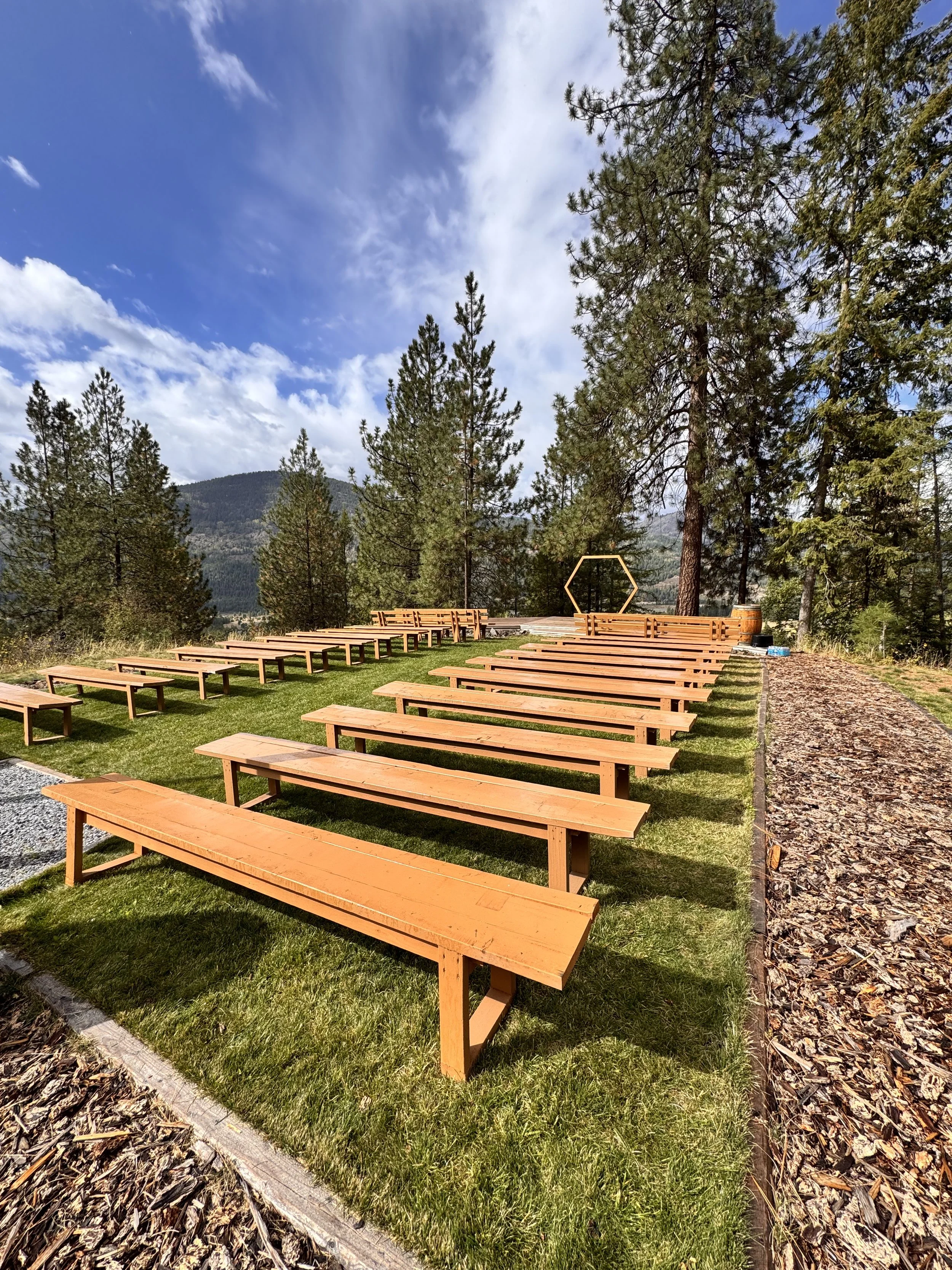 Mountain Soul outdoor ceremony site with wooden benches and mountain views