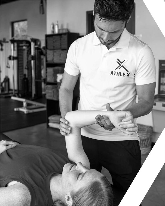 AthleX coach conducting a movement evaluation with a client in Austin, TX