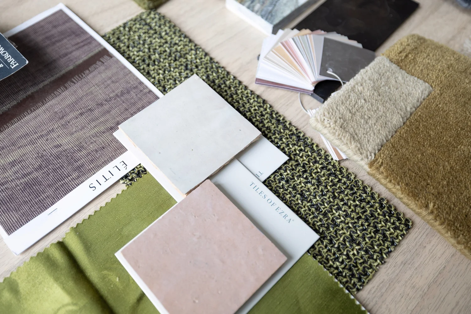 Interior design fabric and finish samples arranged on a table