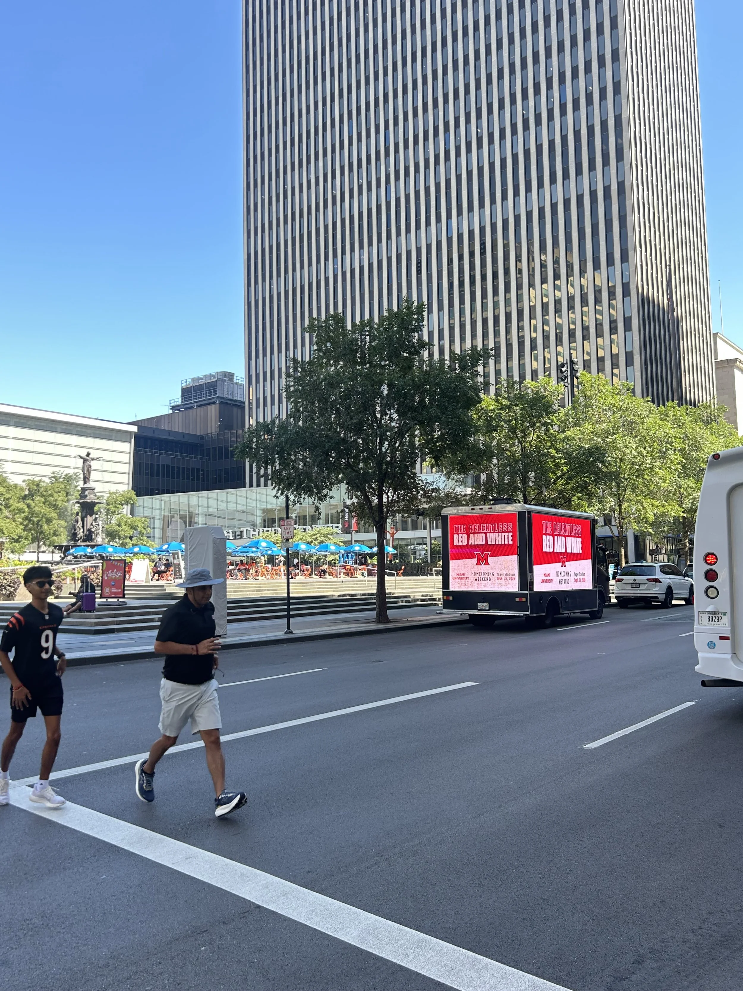Digital billboard truck running a mobile billboard advertising route in downtown Cincinnati, Ohio on NFL game day
