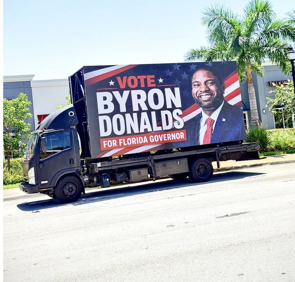 Digital billboard truck displaying political campaign creative
