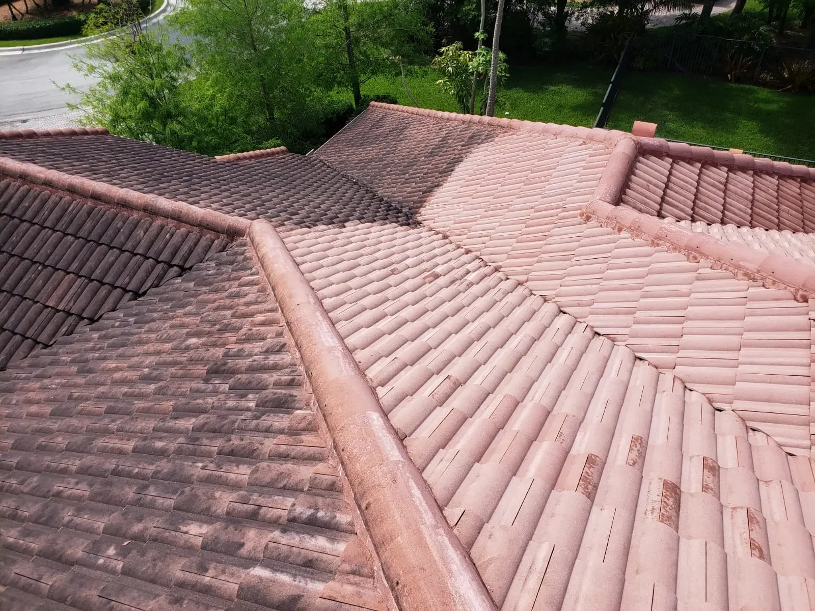 Professional roof cleaning results on a Miami tile roof