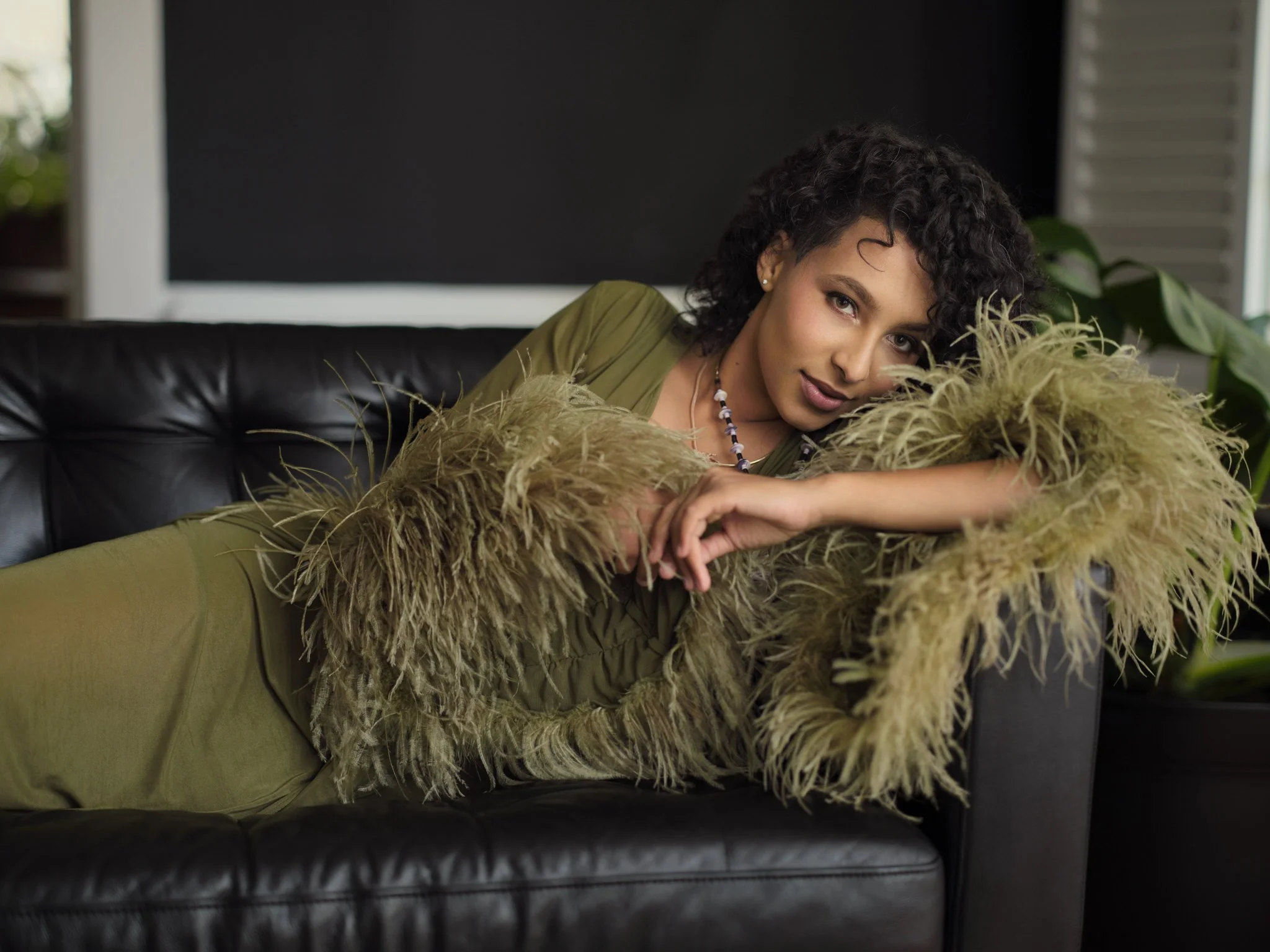 Editorial portrait of a woman in a feather dress, Wilmington, NC