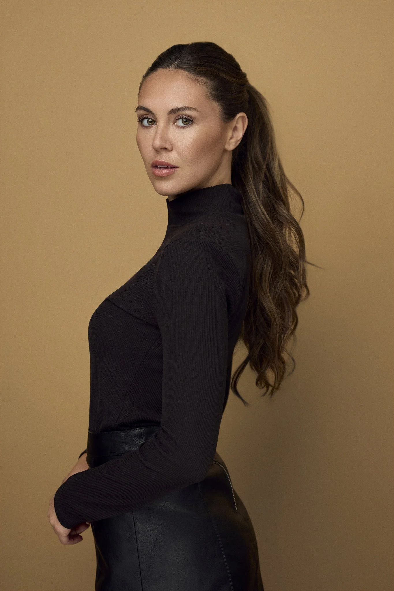 Editorial portrait of a woman in a black turtleneck, Wilmington, NC
