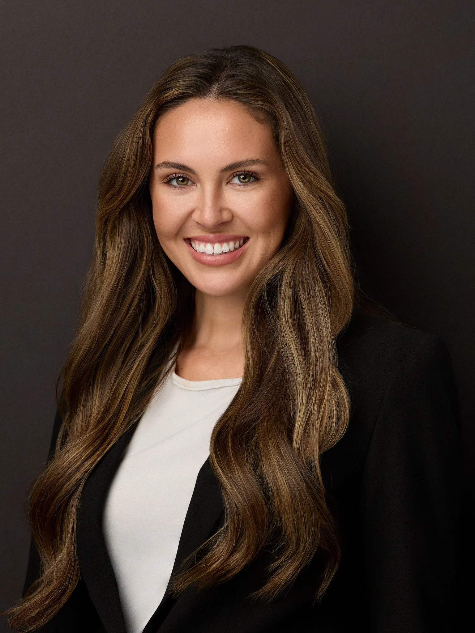 Professional headshot of a woman in a black blazer, Wilmington, NC