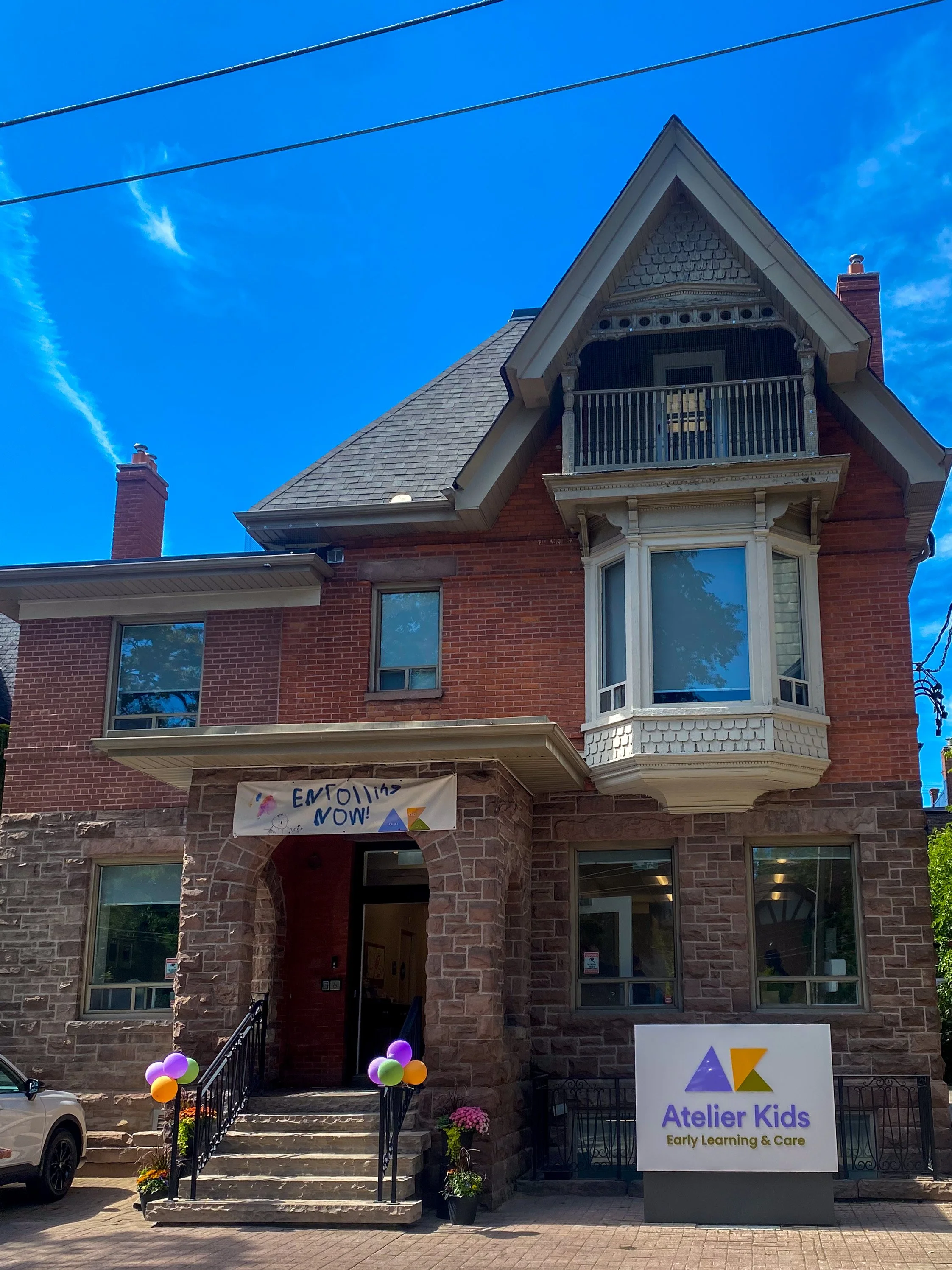 Atelier Kids Annex studio exterior, a red-brick Victorian house