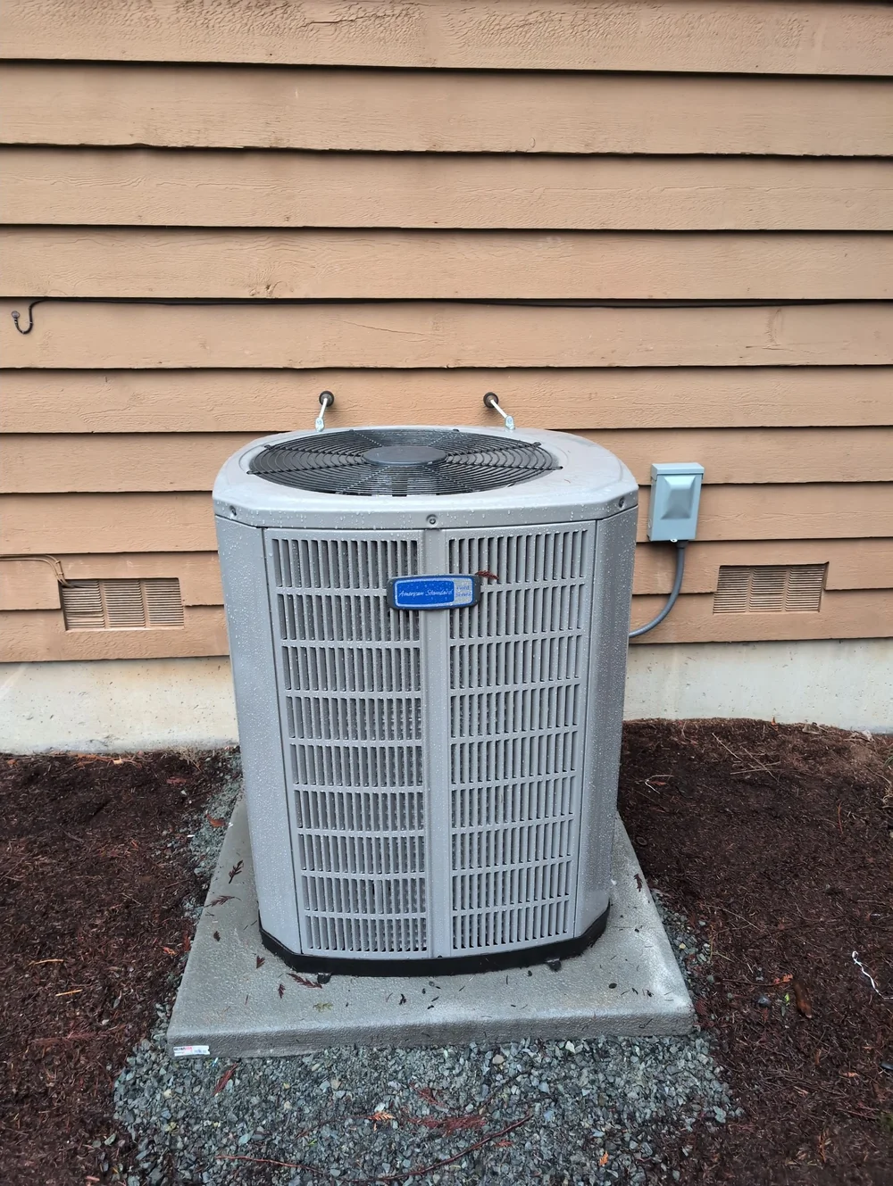 American Standard outdoor unit installed by Endeavor on a concrete equipment pad