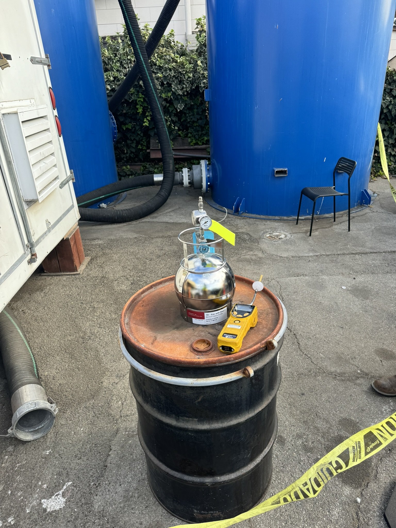 Summa canister vapor sampling and PID monitoring at an active groundwater treatment site with above-ground air stripper tanks and safety perimeter