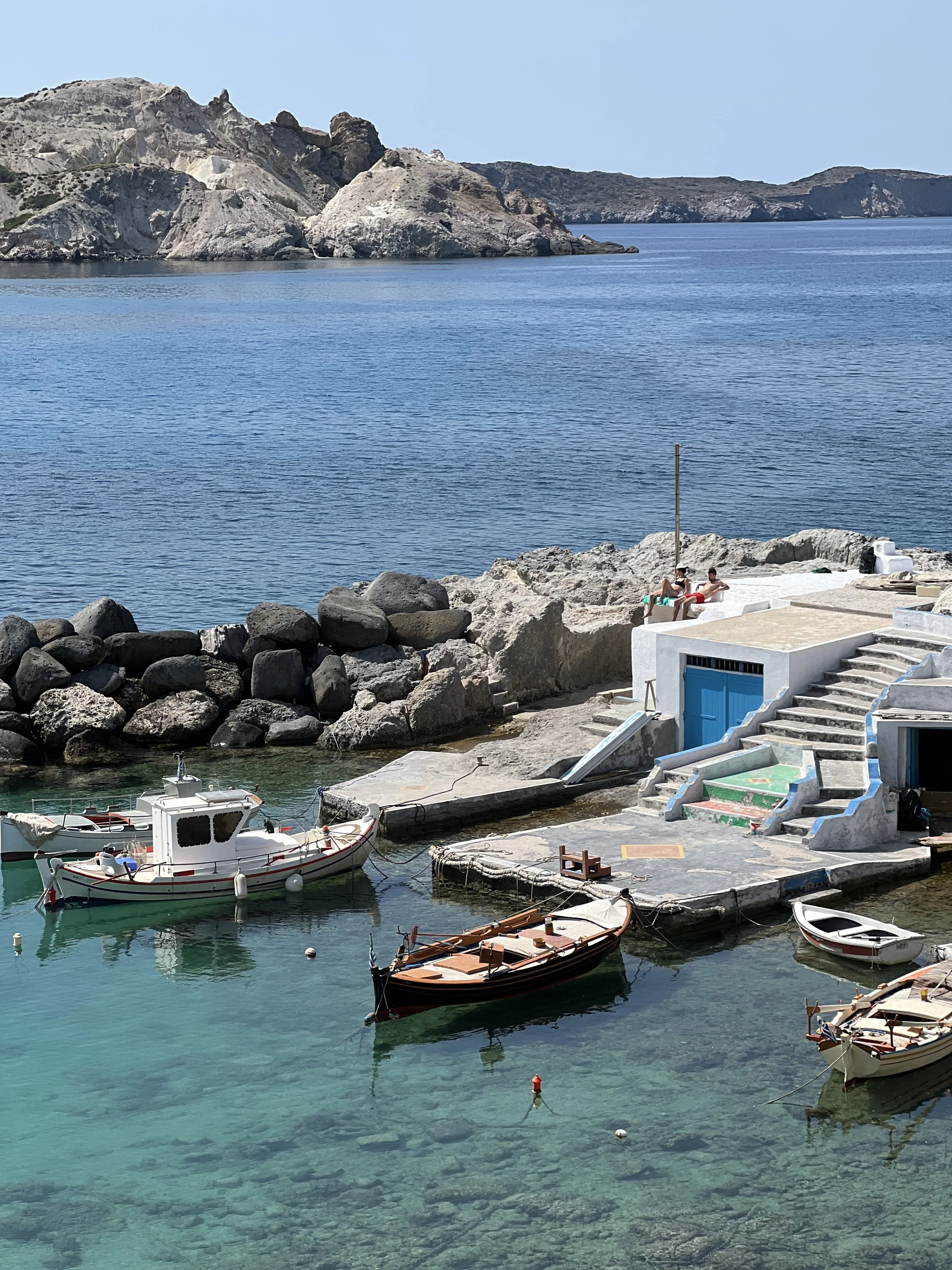 Small fishing boats in the harbor at Milos, Greece