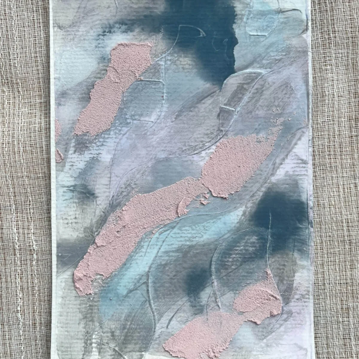 Artwork Between Breaths No. 1 – calm abstract painting in soft blue, silver-grey, and muted pink tones. Textured surfaces and subtle brushstrokes express a sense of clarity and breath.