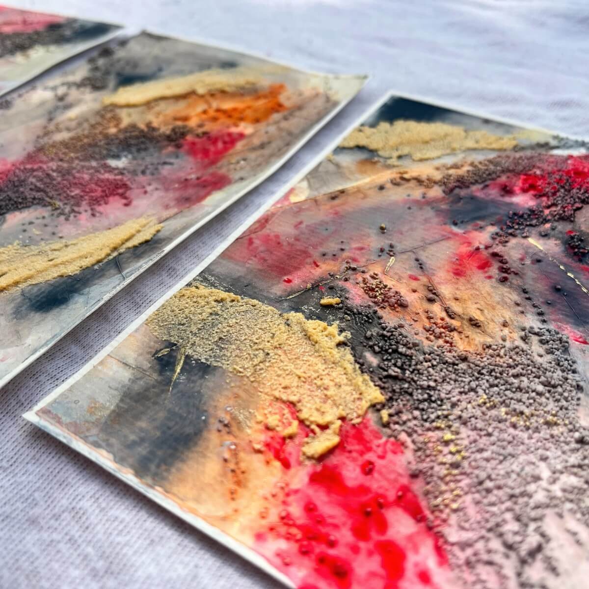 Close-up of the textured surface from the “And The Fire Within” series – bold pigments and granular textures reflecting emotional intensity and release.