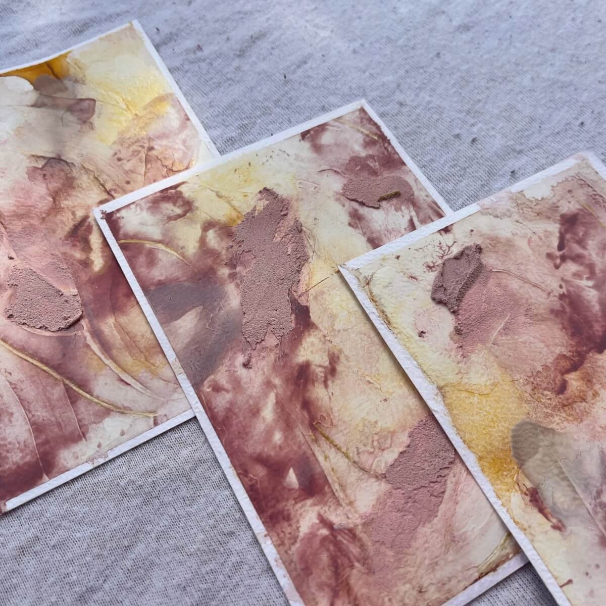 Three artworks from the “Held By Myself” series – soft beige, brown and blush tones with gentle textures, inspired by self-love and mindful self-acceptance.