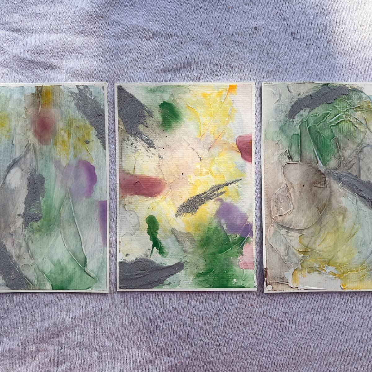Three artworks from the “Between the Seconds” series in sunlight – soft green, yellow and pink hues reflect the quiet presence of mindfulness and gratitude.