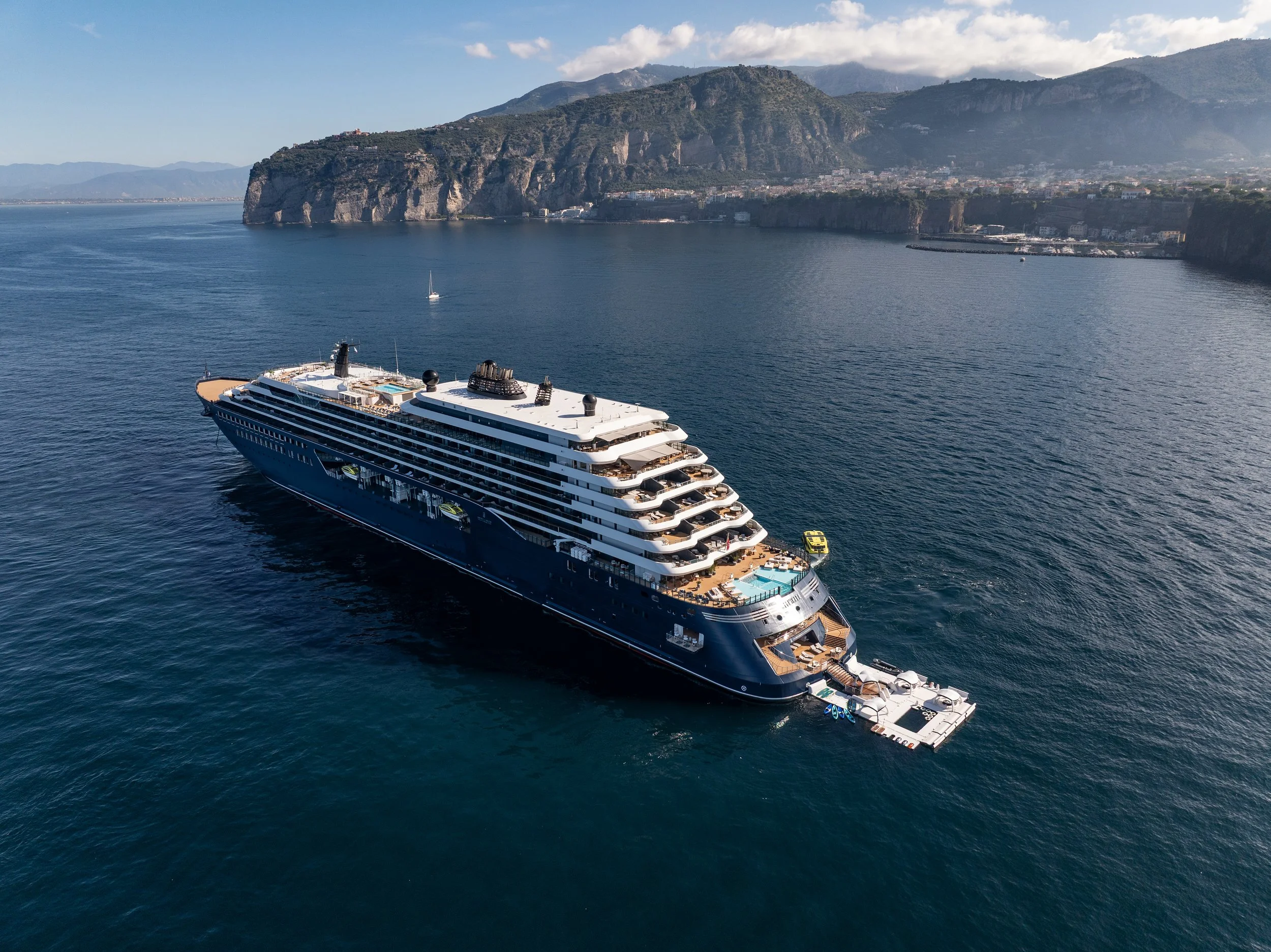 The Ritz-Carlton Yacht Collection yacht Luminara anchored off Sorrento with its marina deployed