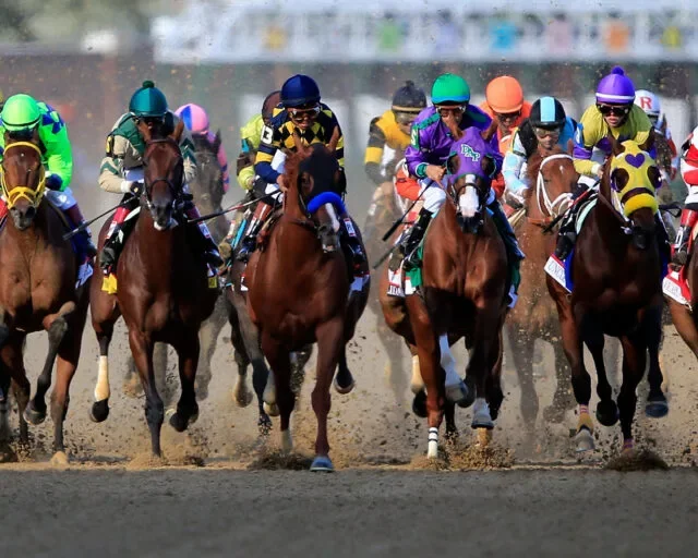 Thoroughbred horses racing at Churchill Downs during the Kentucky Derby