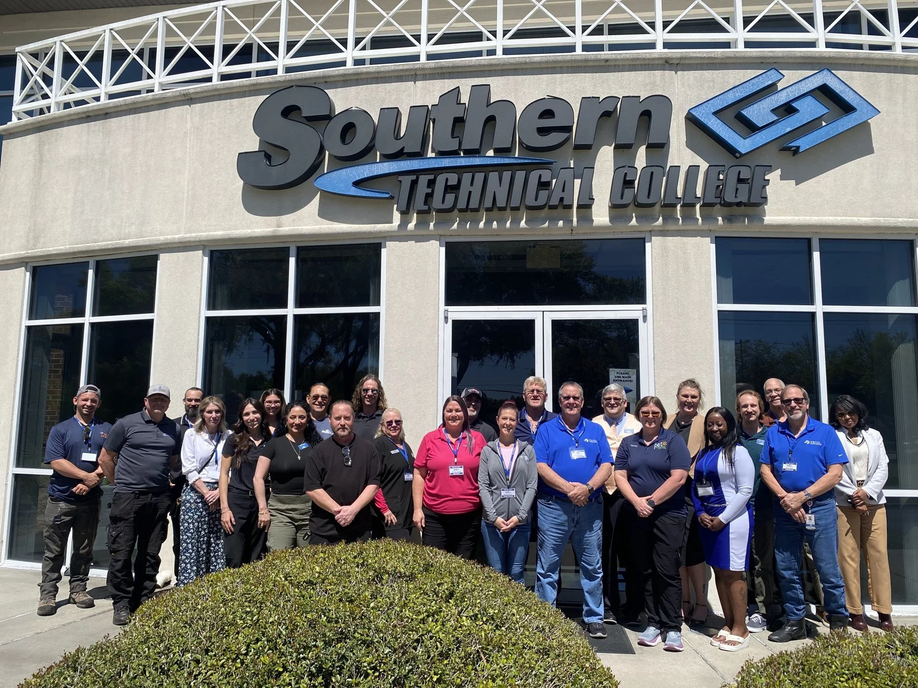 Employer and advisory participants posing together outside Southern Technical College after a Program Advisory Committee meeting.