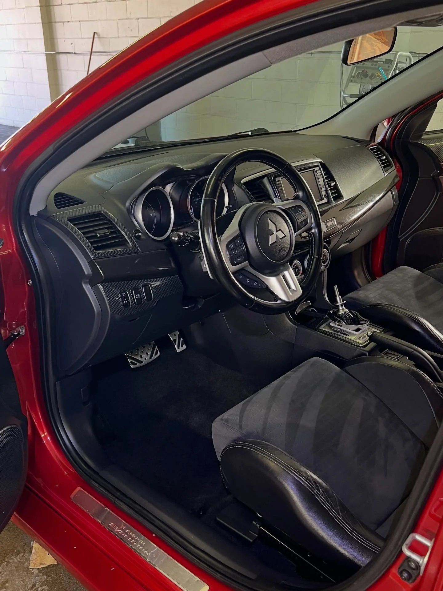 Mitsubishi interior detailing with clean dashboard and seats Lincoln Nebraska