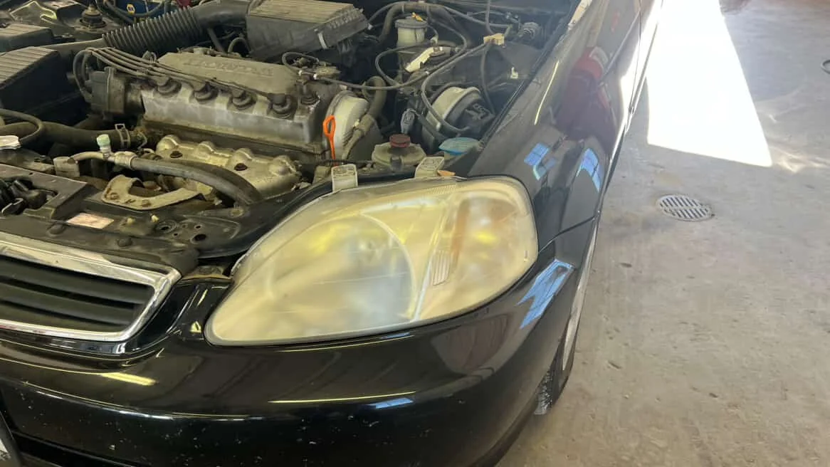 Before headlight restoration on Honda Civic Type R: faded oxidized headlight lens needing restoration service Lincoln NE