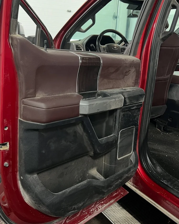 Stained car carpet before professional detailing in Lincoln NE