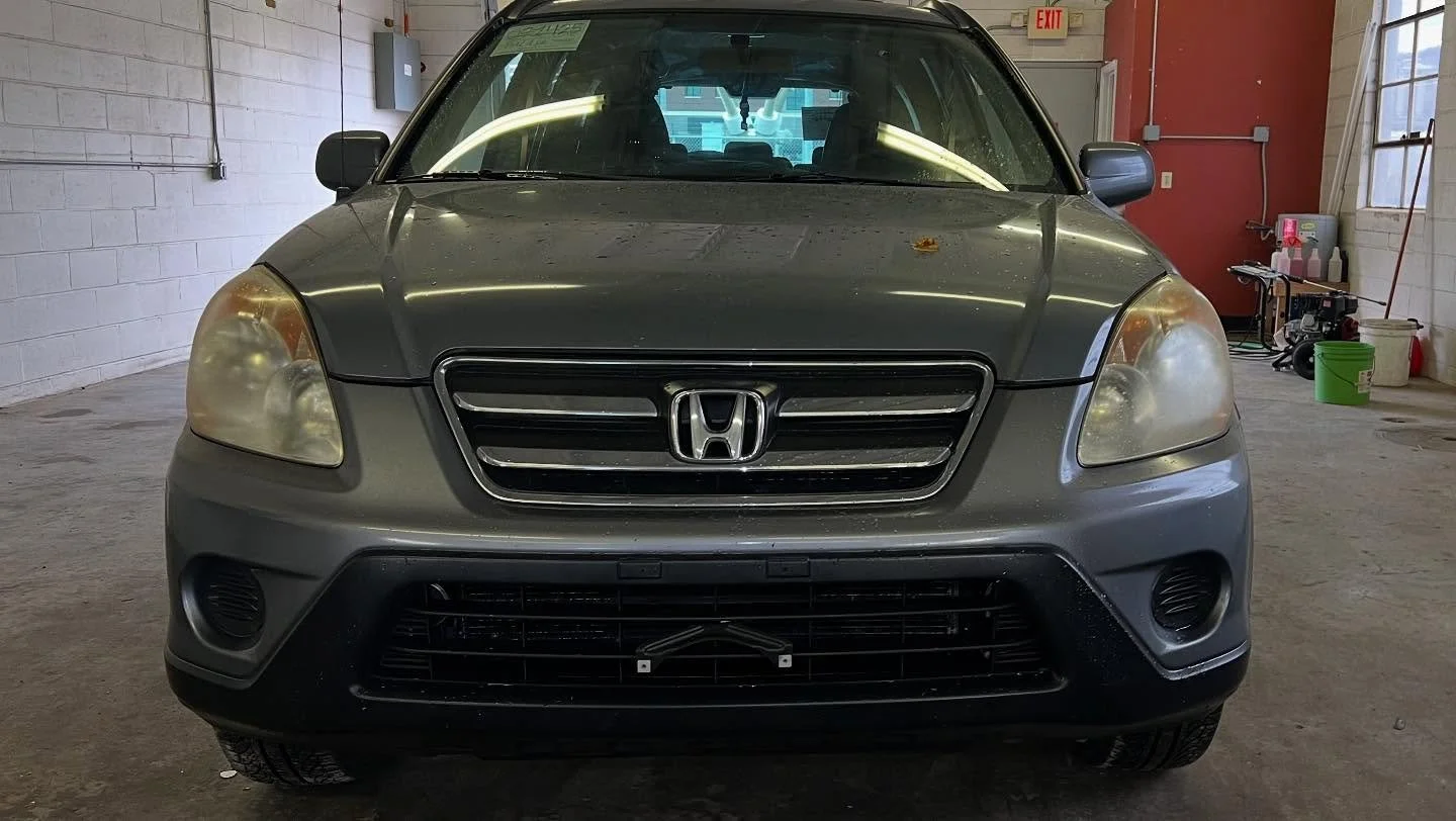Before professional headlight restoration: faded, cloudy headlights on a customer vehicle in Lincoln NE