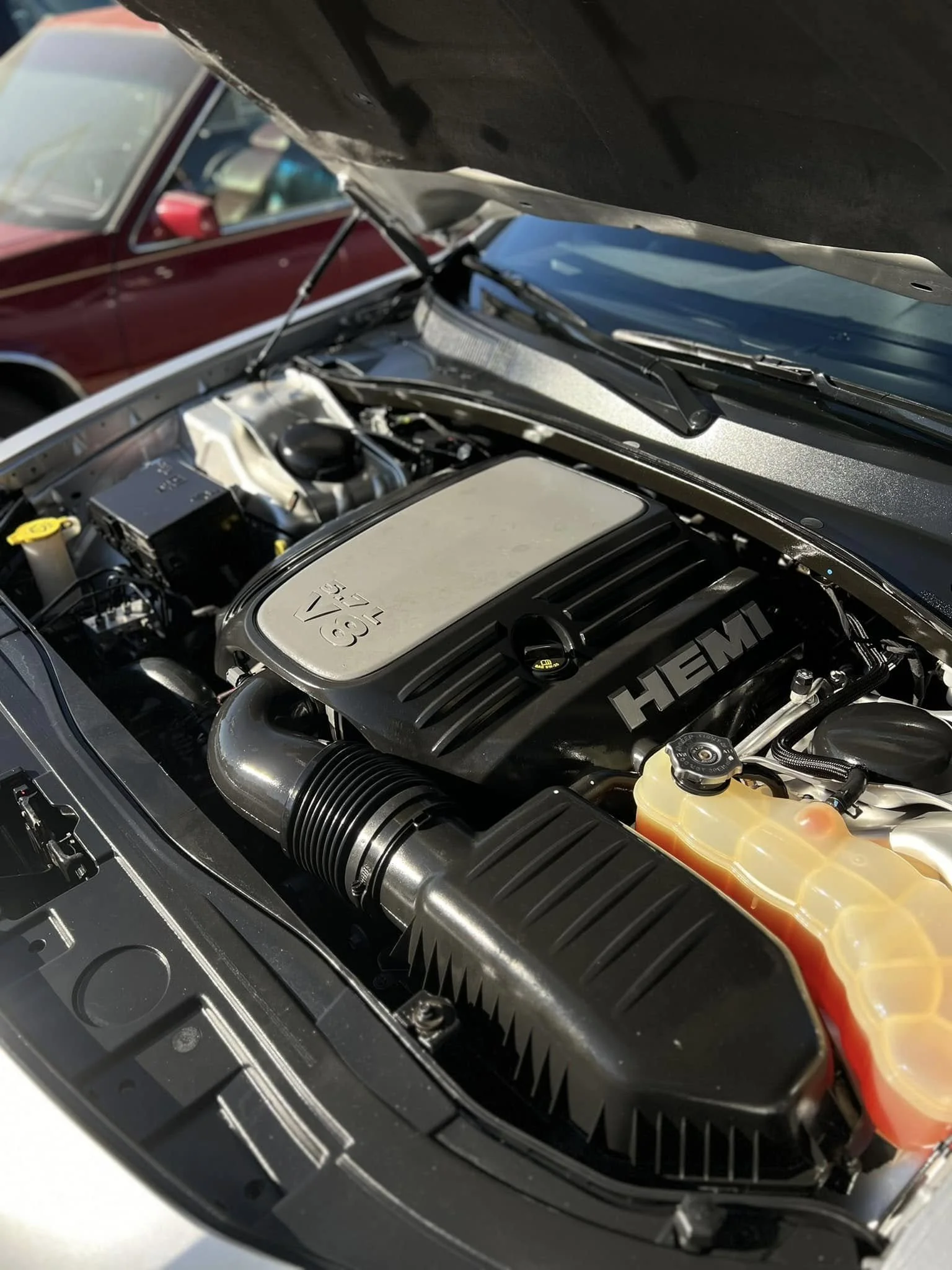After: clean and dressed engine bay with uniform finish and improved presentation – MC Auto Detailing Lincoln