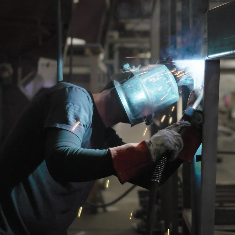 Welder in the Trails West Trailers factory