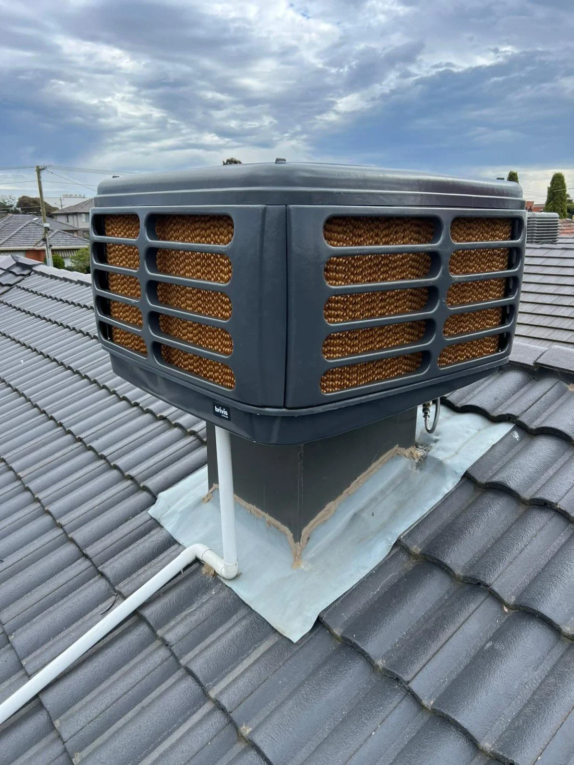 Pro-Tech evaporative cooler installation on a tiled roof