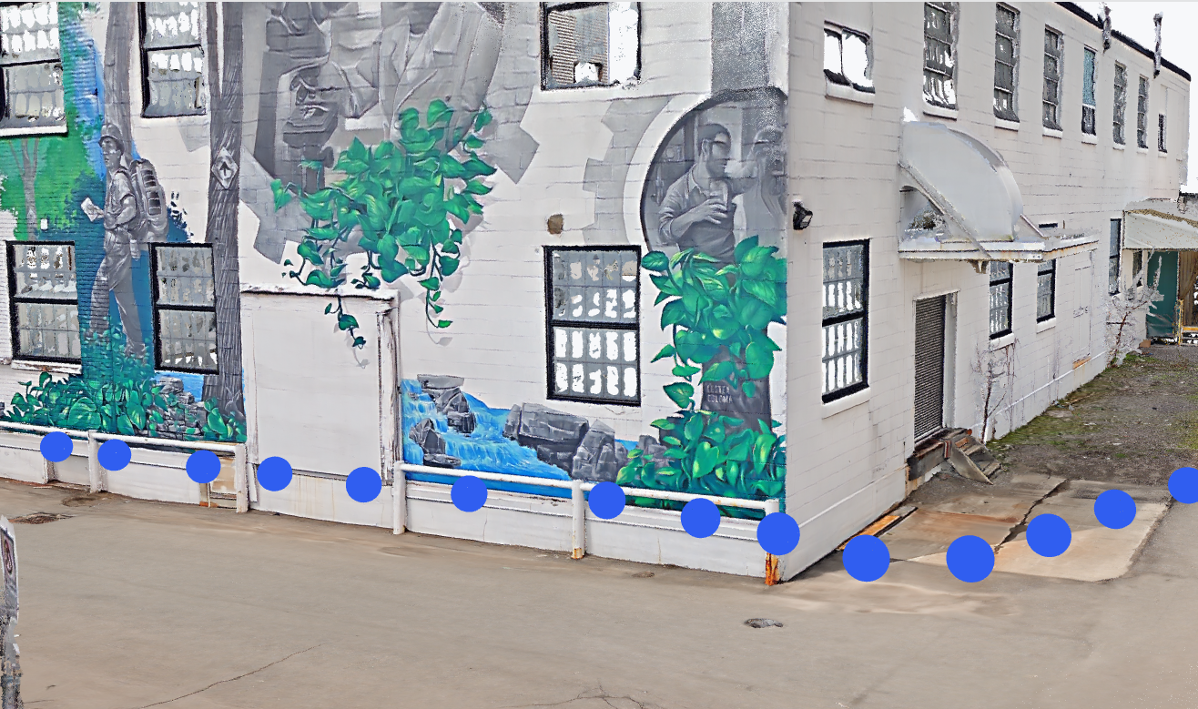 Outdoor 3DGS scan of a mural and building facade