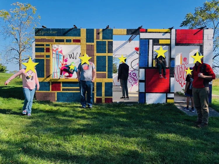 Families explore the painted structure at Weir River.