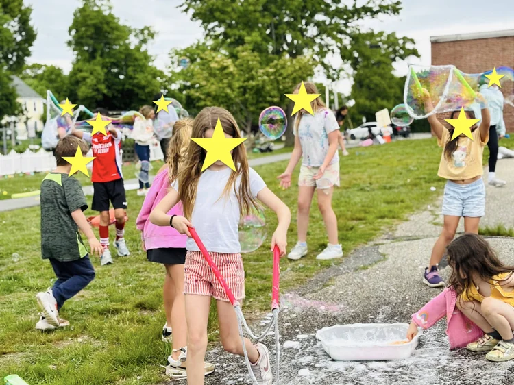 Children making bubbles at SSDW Play Days.