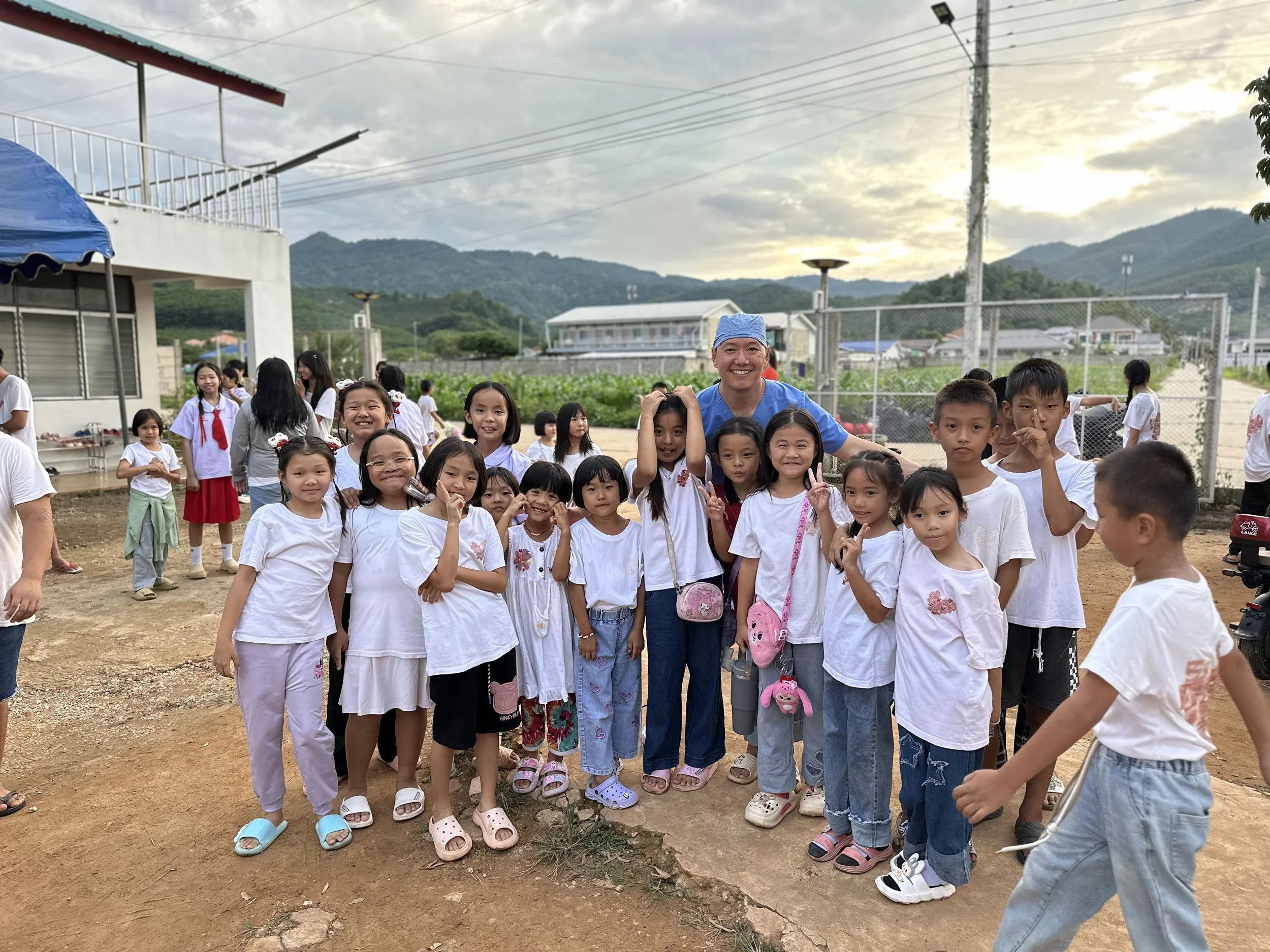 Founder of Prime Emergency Dental on a dental mission trip with children