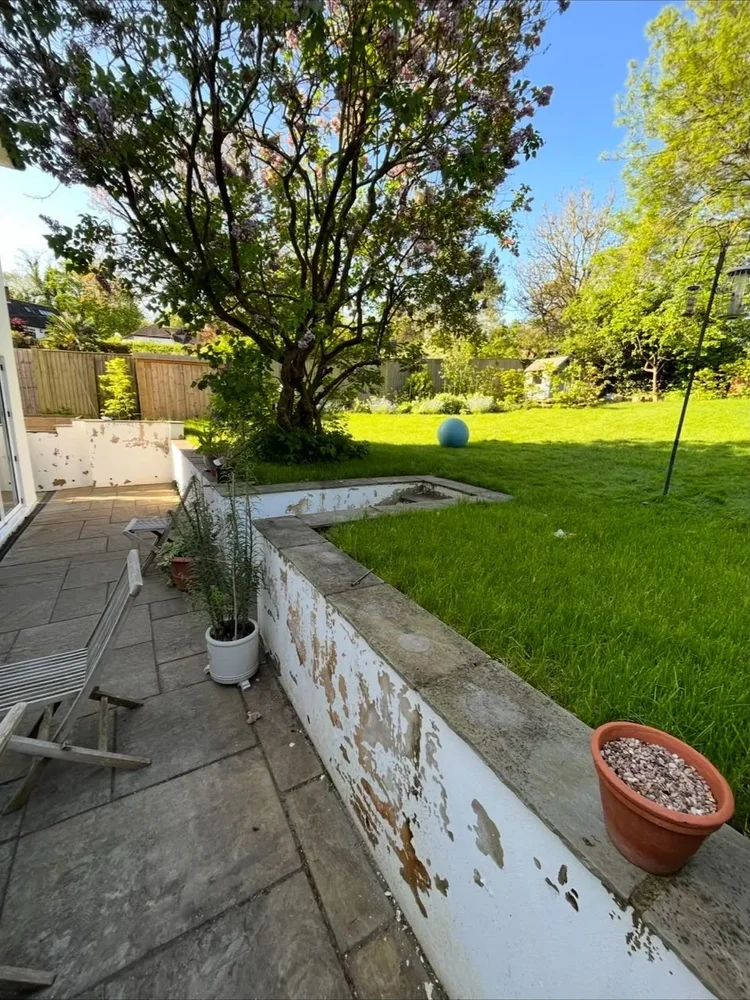 Garden terrace and retaining wall at a Surrey property