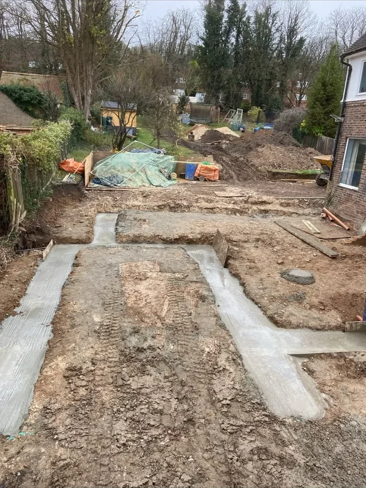 Concrete foundations poured for a rear house extension in Surrey