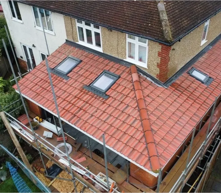 House extension roof with rooflights and scaffolding, Guildford area