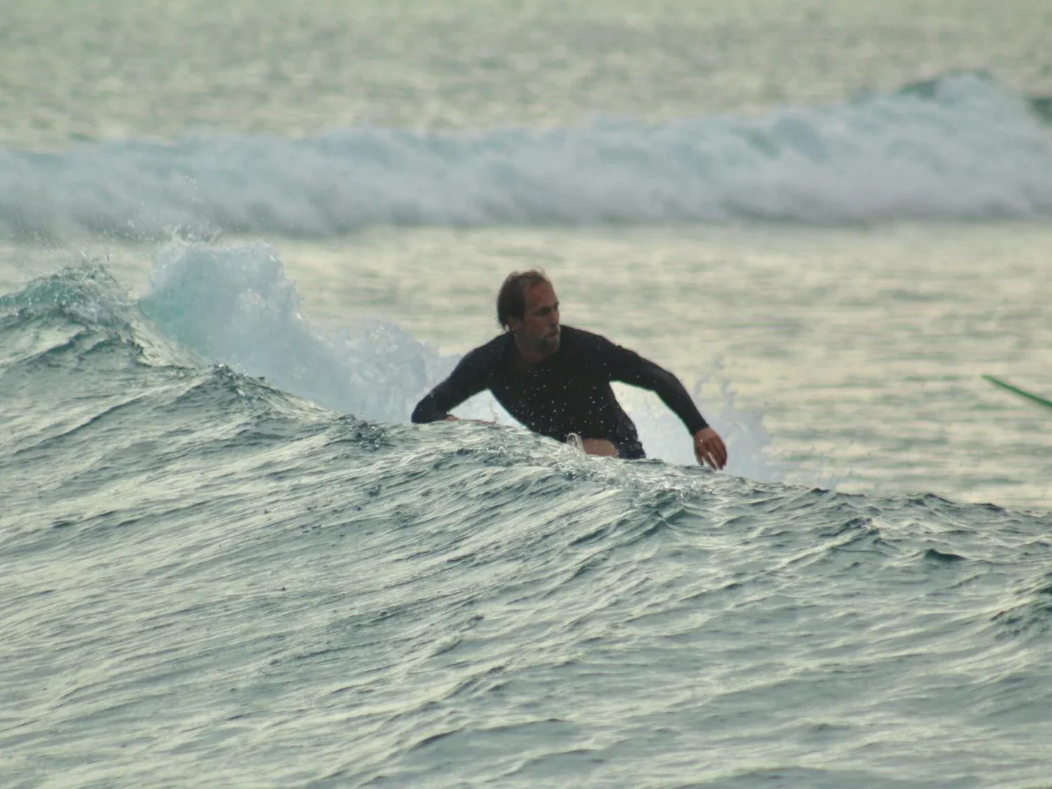 Surfer at Tanjung Aan beach, South Lombok