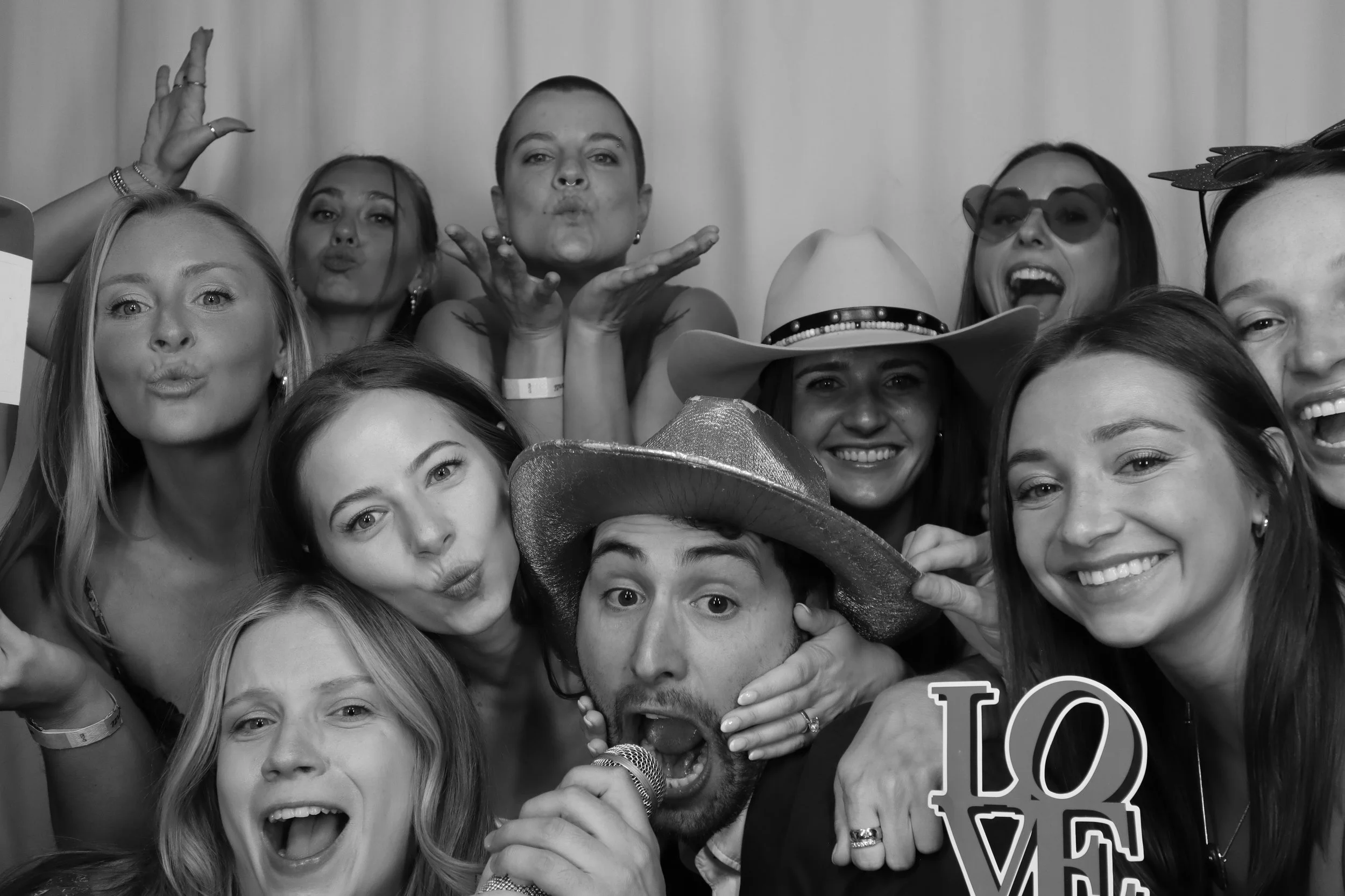 Wedding guests posing with props