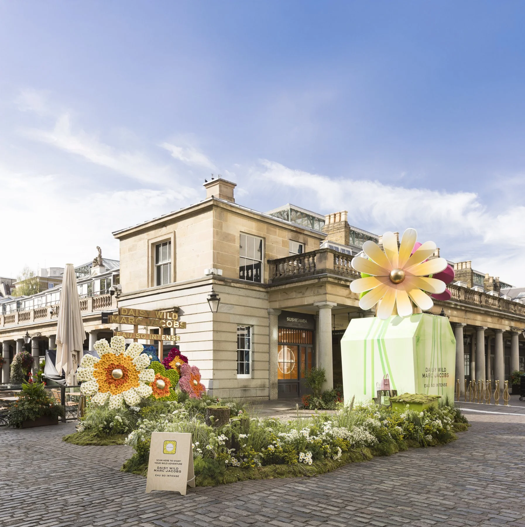 Marc Jacobs Daisy Wild floral installation outside Covent Garden with giant daisies and oversized fragrance bottle