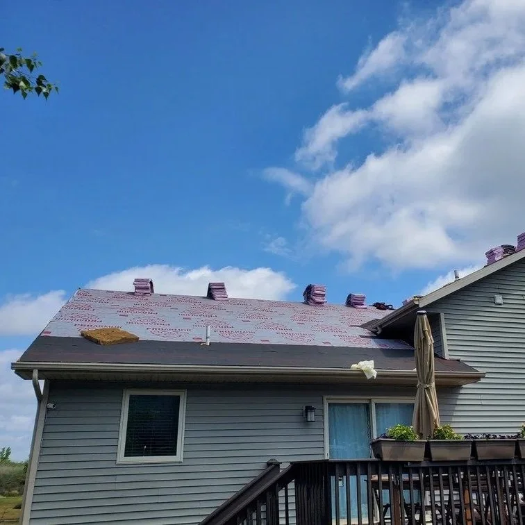 snow covered roofline with ice dam at eave