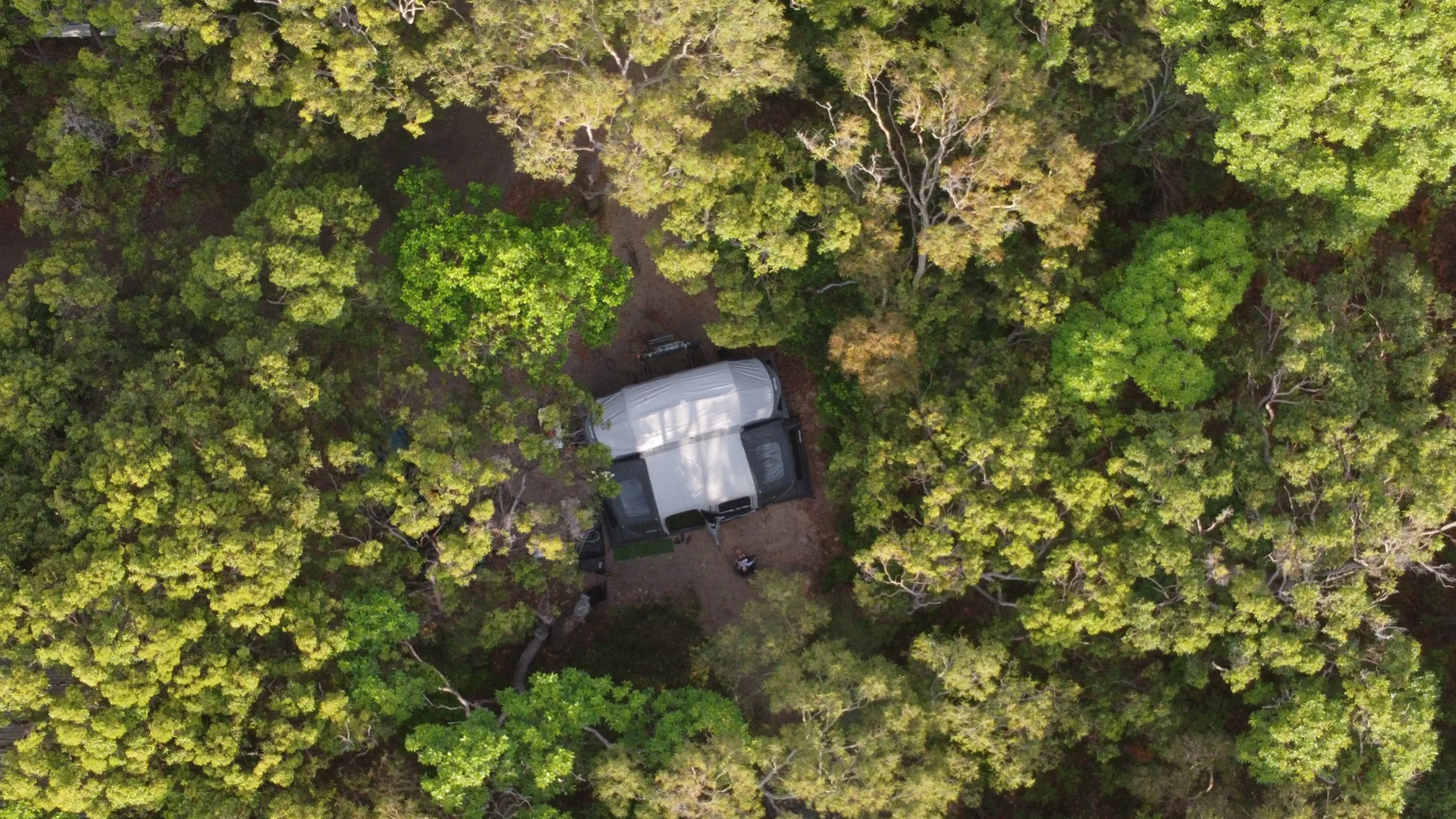 Aerial view of Woodstock the Opus OP4 camper trailer set up at camp