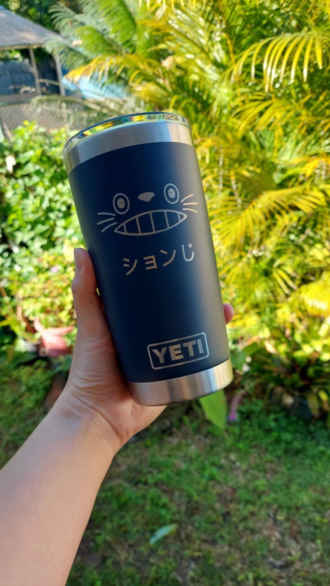 Blue tumbler with cat engraving