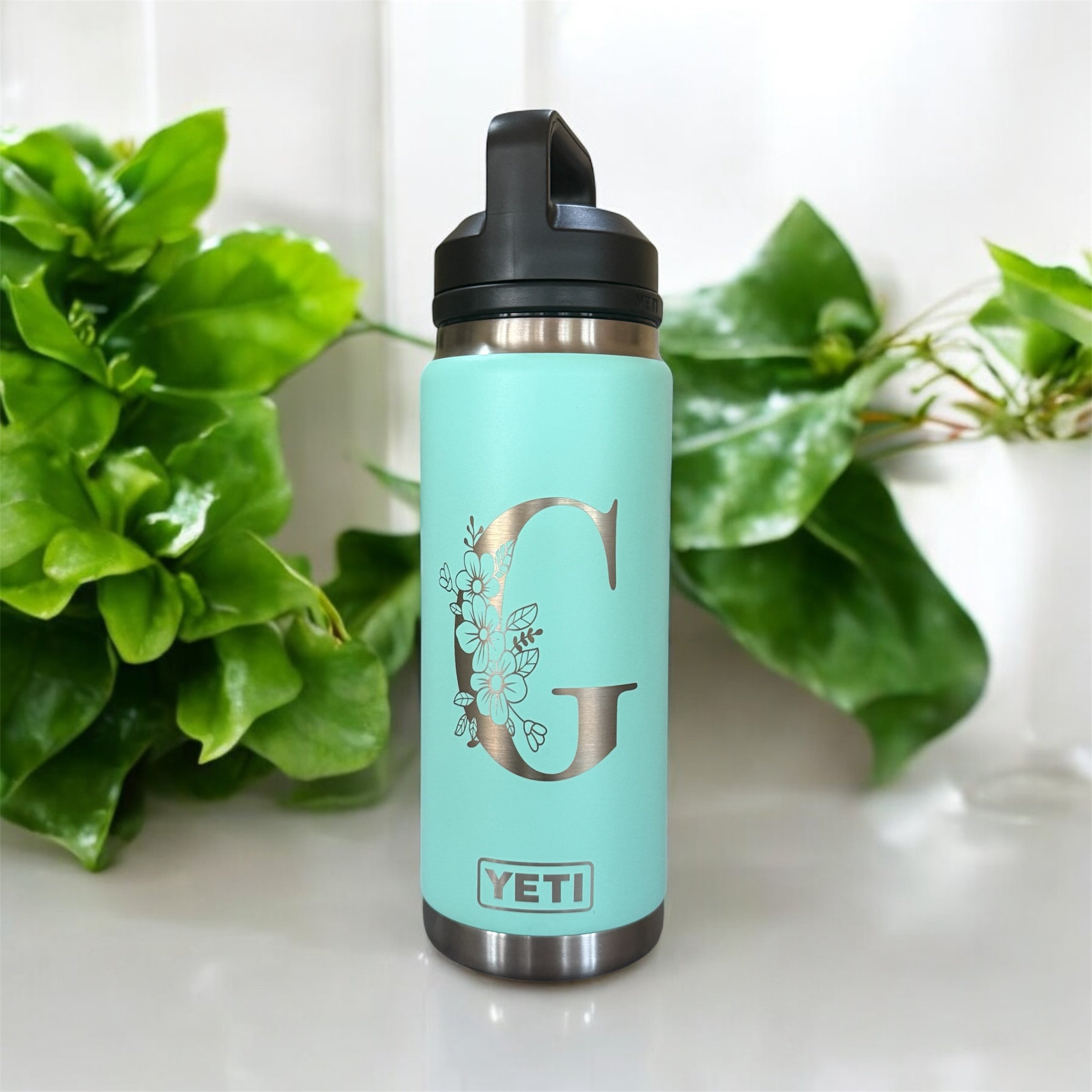 Mint bottle with floral G engraving