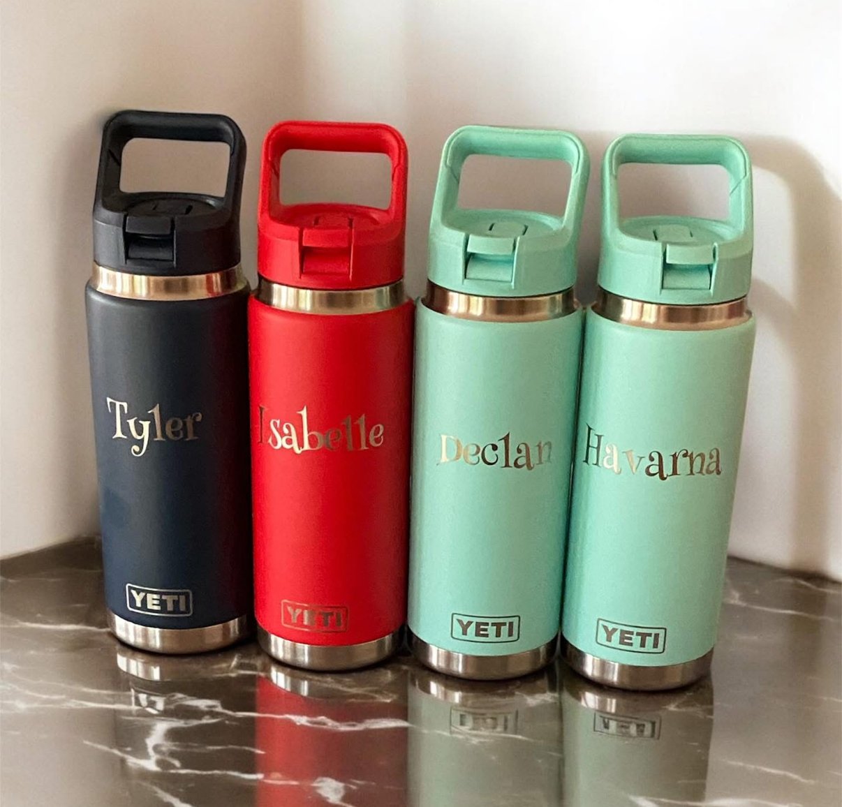 Four personalised name bottles