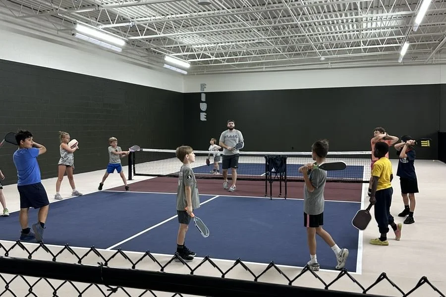 Tyler Firth coaching the Club 65 Junior Program