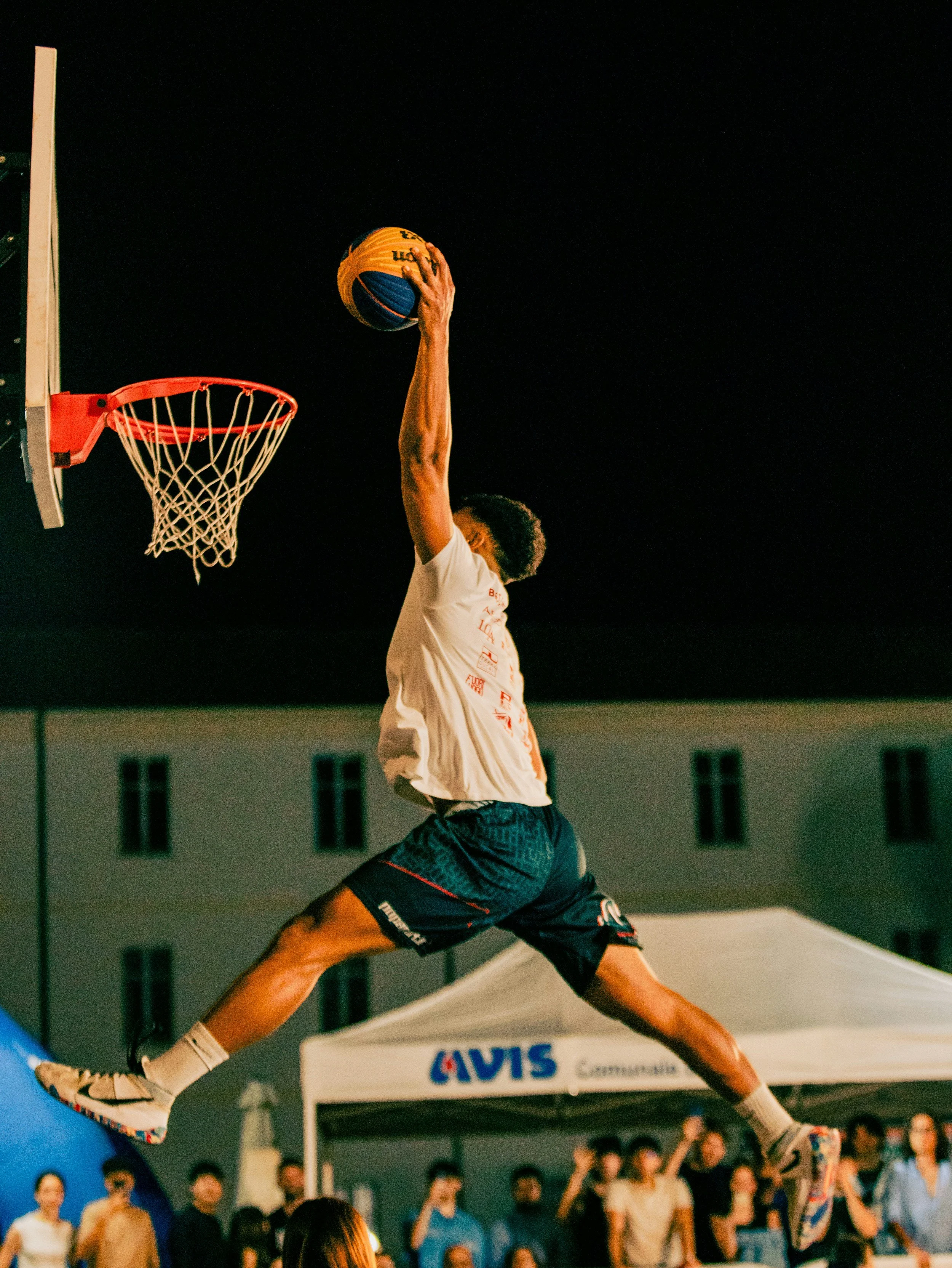 Athlete demonstrating explosive vertical jump powered by proximal-to-distal force transfer from hips through legs