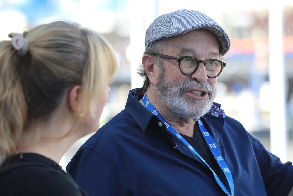 An Original Hamburg Walks guide sharing stories with a guest