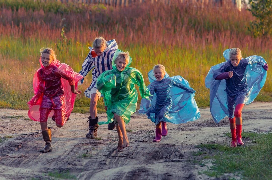 Children running together, illustrating social and communication signs in autism