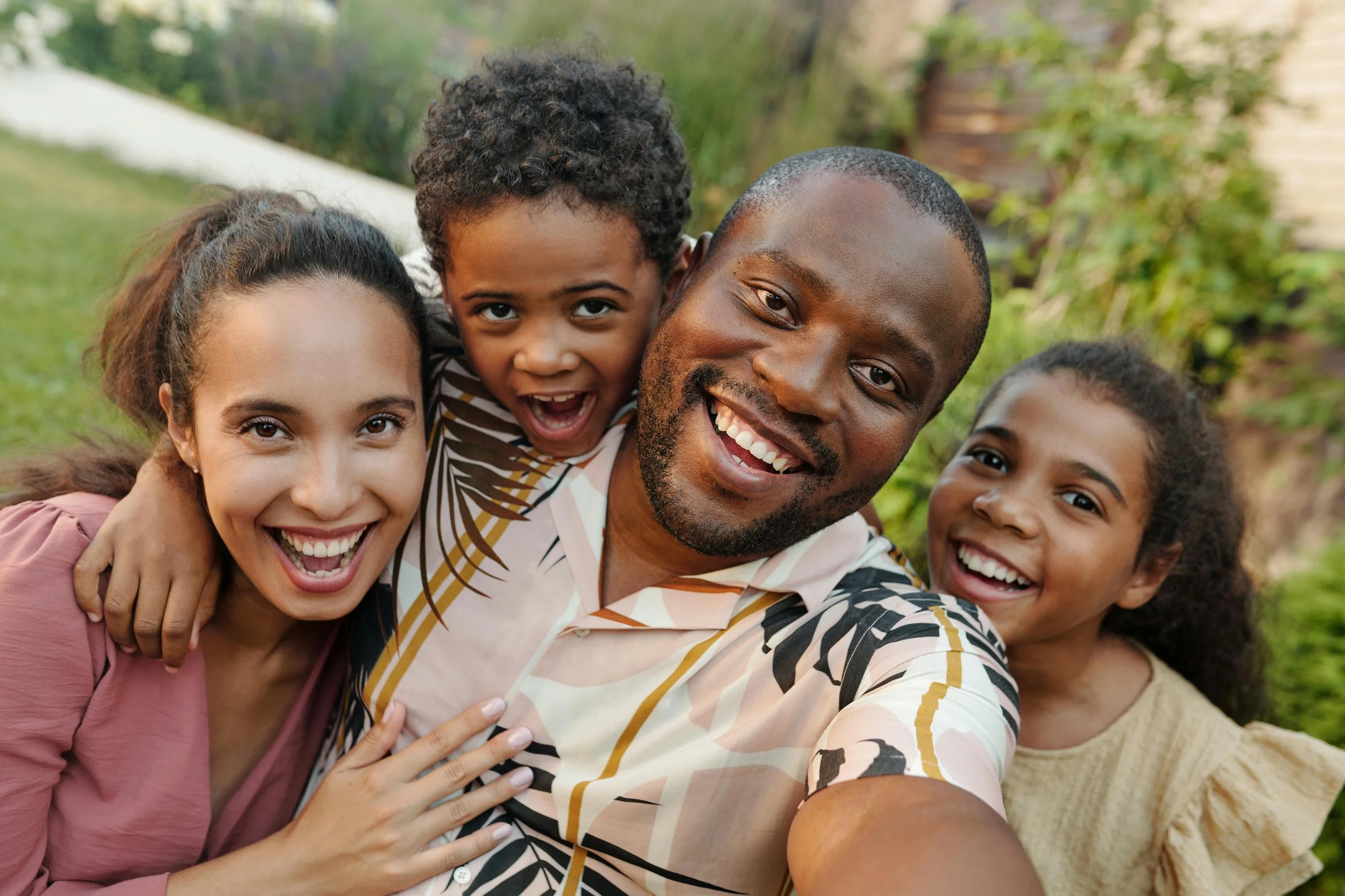 Smiling family receiving compassionate therapy support at SHIELD Psychiatry