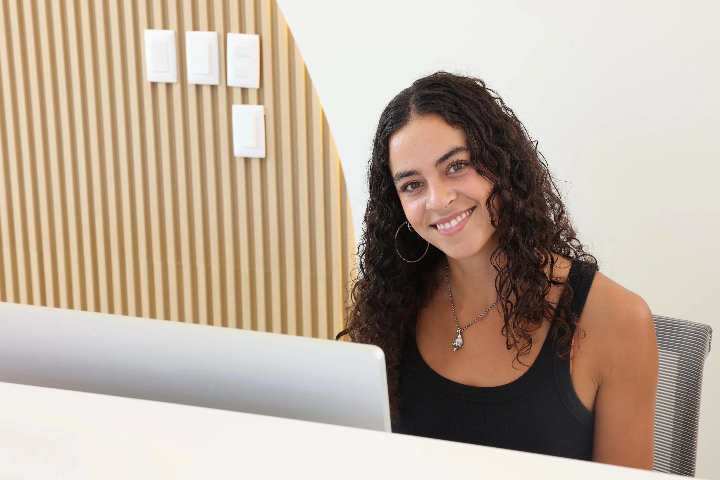 Mariana at the reception desk