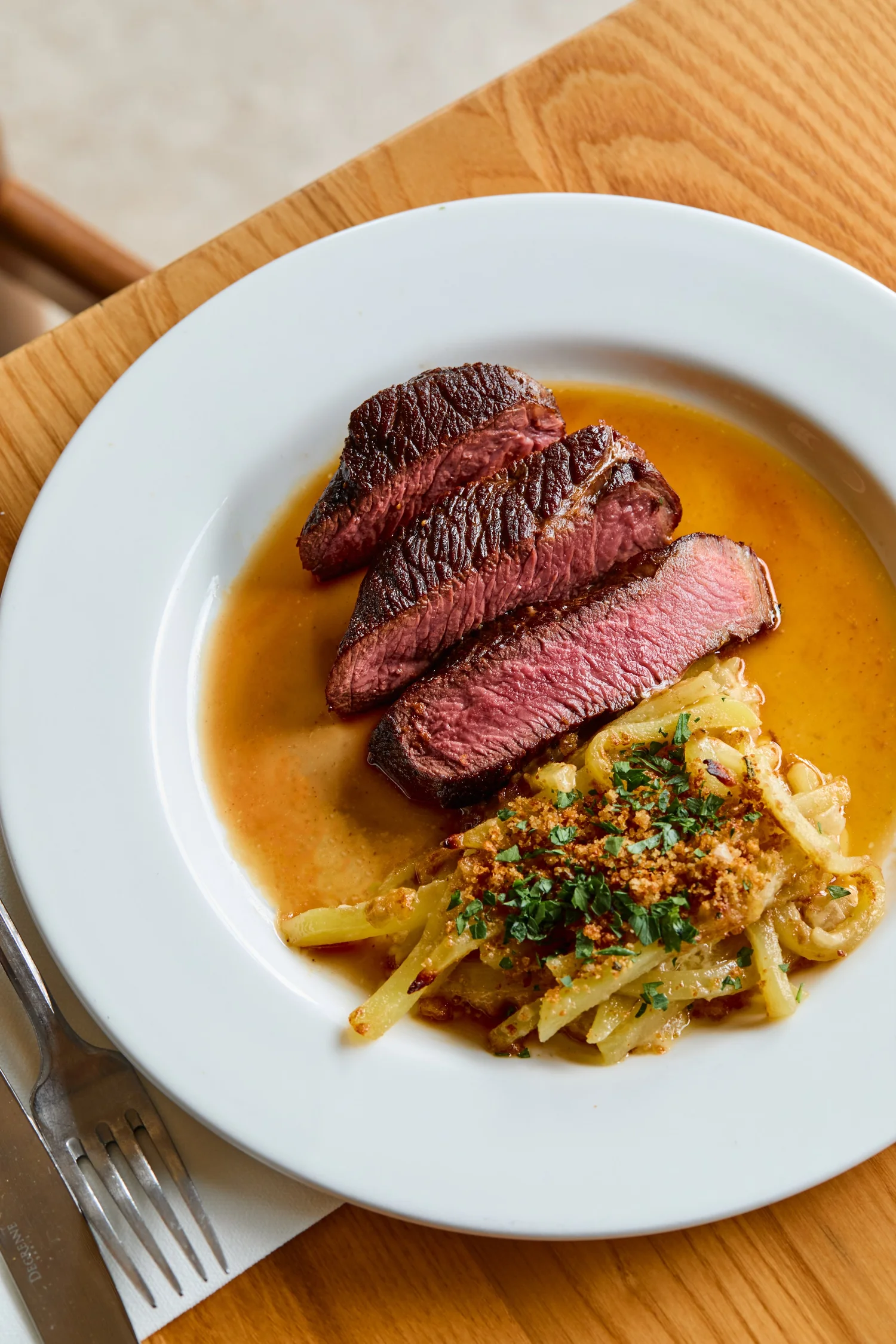 Sliced bavette steak with sauce